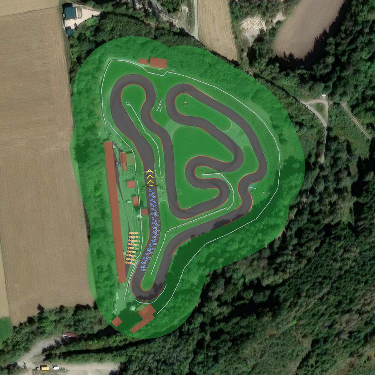 Top-down preview of Ampfing Kart Bahn with the generated road, kerbs and grid overlaid on satellite imagery