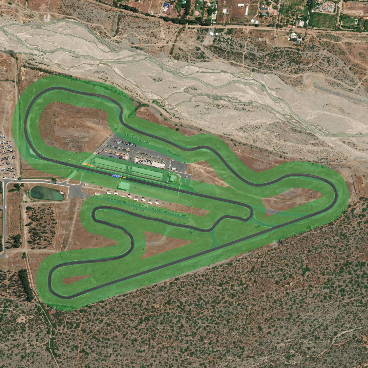 Top-down preview of CodeguaCircuit with the generated road, kerbs and grid overlaid on satellite imagery