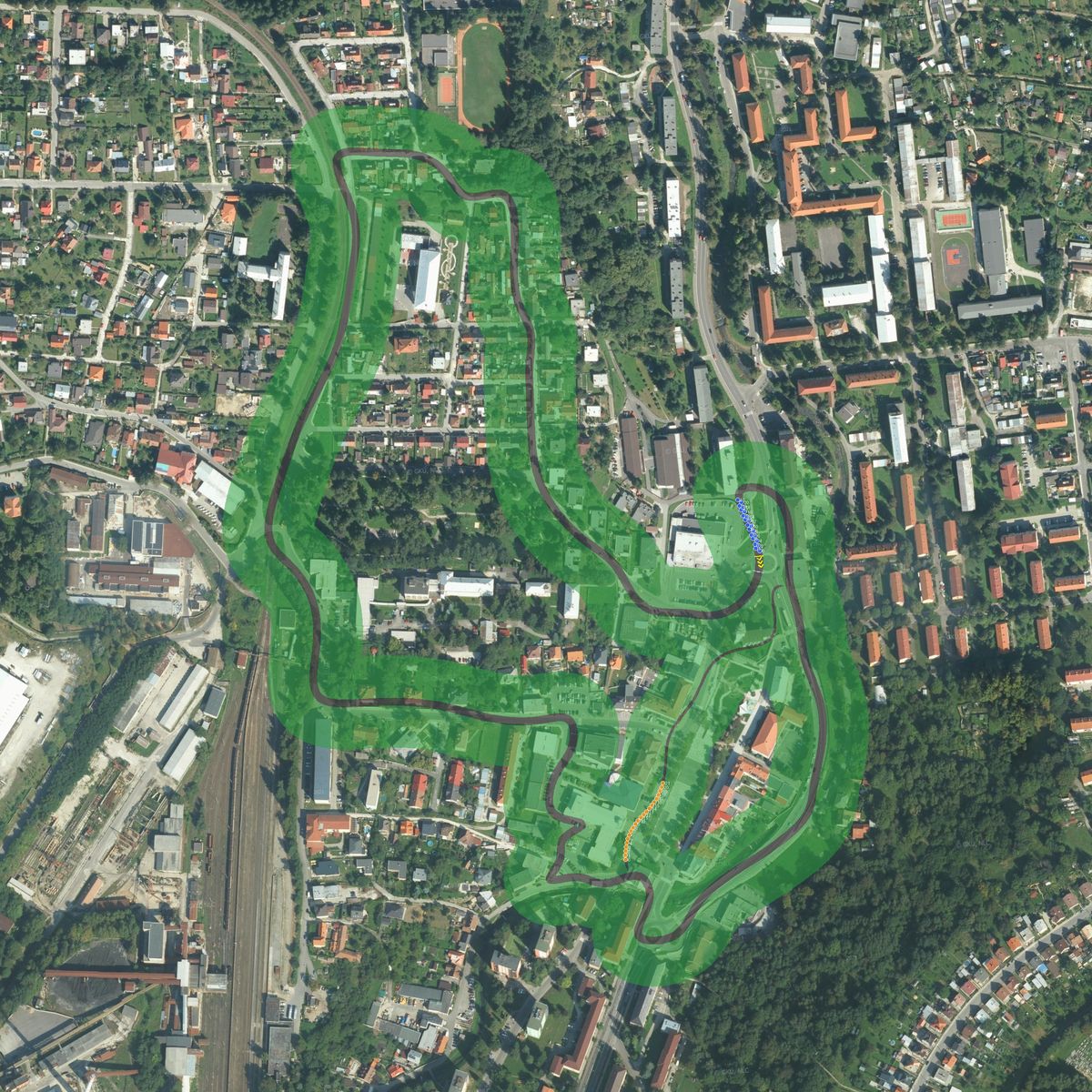 Top-down preview of Slovenska Sporitelna Handlova GP in Slovakia with the generated road, kerbs and grid overlaid on satellite imagery