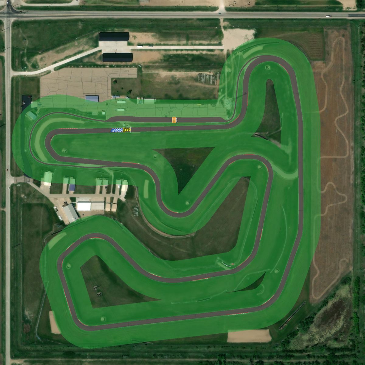 Top-down preview of Motorsport Park Hastings with the generated road, kerbs and grid overlaid on satellite imagery