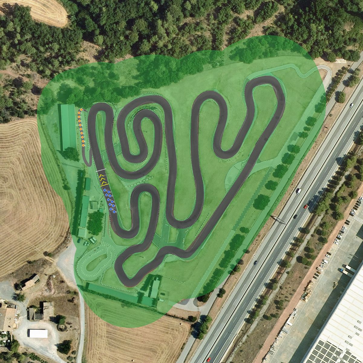 Top-down preview of Karting Sallent with the generated road, kerbs and grid overlaid on satellite imagery