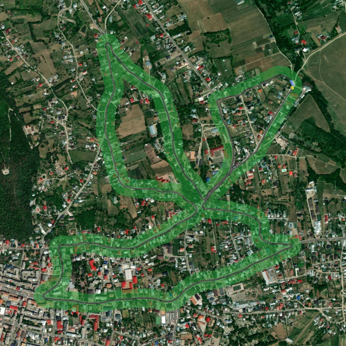 Top-down preview of targhu neamt si oglinzi dupa with the generated road, kerbs and grid overlaid on satellite imagery